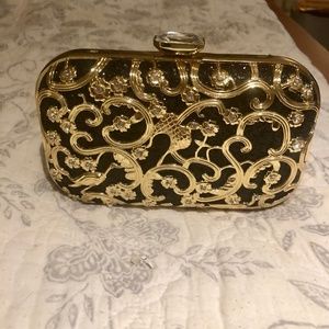 A fawziya handbag gold and black.